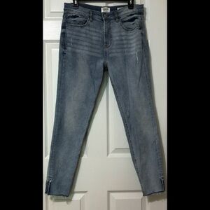 Lightly Distressed Light Wash High Rise Skinny Jeans with Ankle Slit